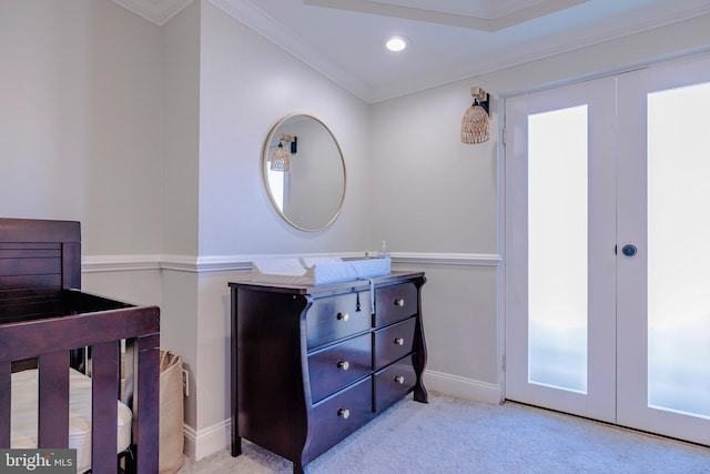 bedroom with light carpet, french doors, and ornamental molding