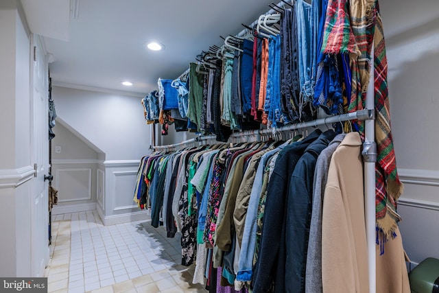 walk in closet with light tile patterned flooring