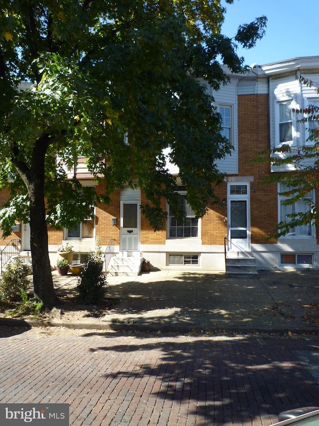 view of property hidden behind natural elements