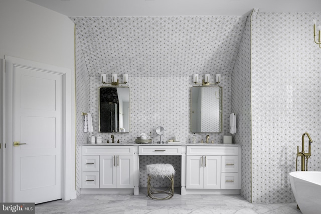 bathroom featuring vanity and a tub to relax in