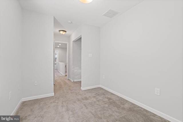 spare room with light colored carpet