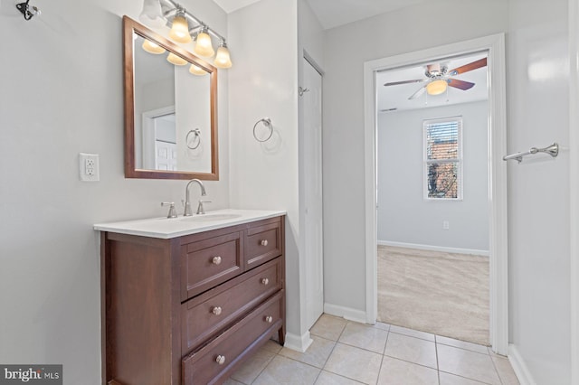 bathroom featuring tile patterned flooring, vanity, and ceiling fan