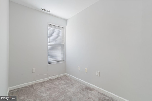 empty room featuring light colored carpet