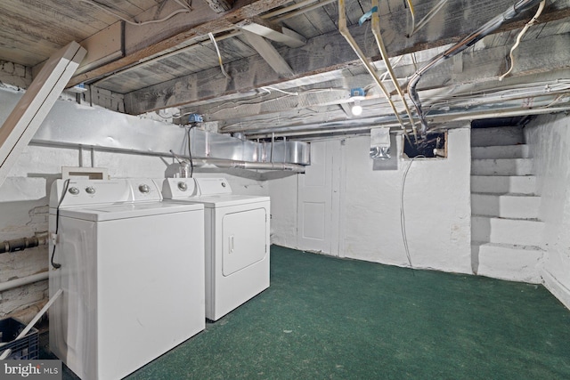 washroom with washer and dryer and dark colored carpet