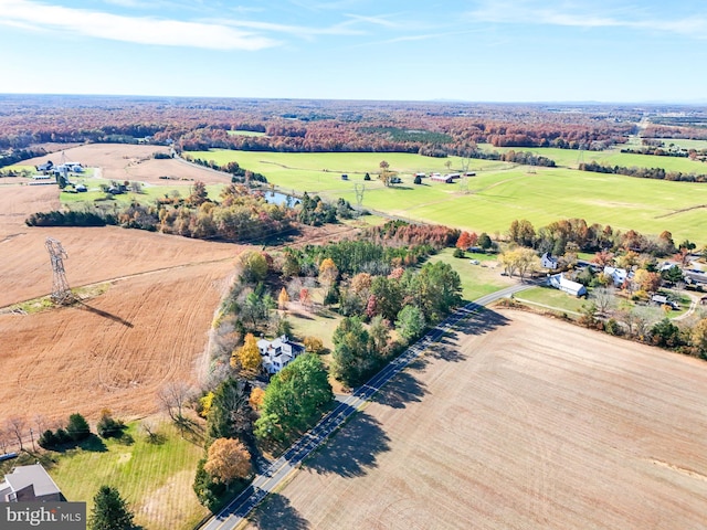 birds eye view of property with a rural view