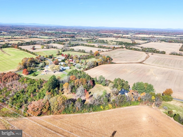 birds eye view of property with a rural view