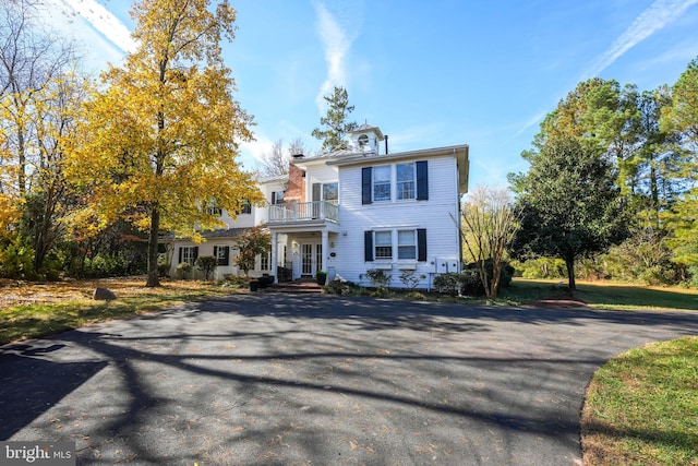 view of front of property with a balcony