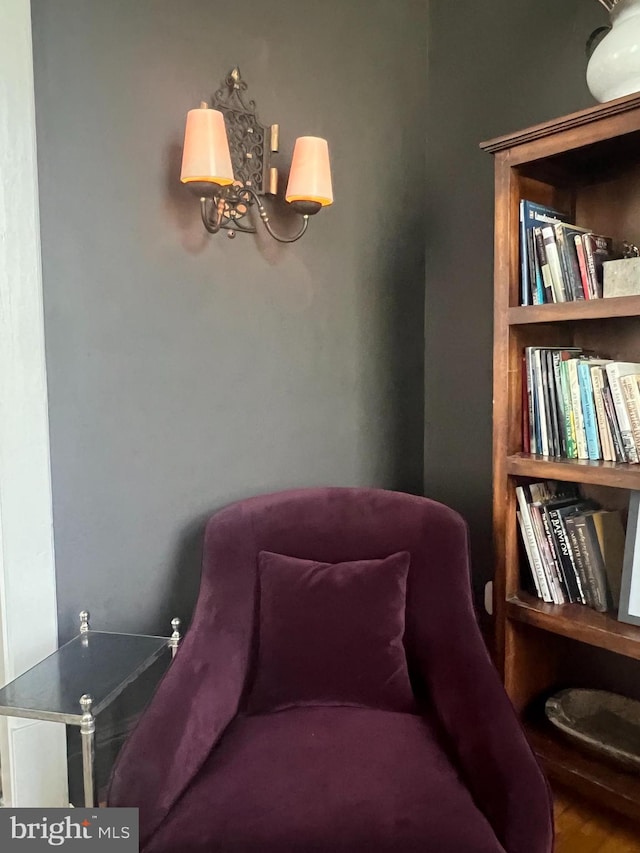 sitting room with hardwood / wood-style flooring