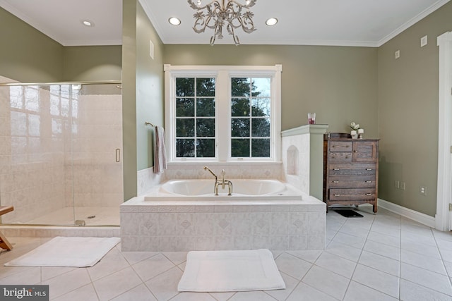 bathroom with ornamental molding, tile patterned floors, a garden tub, an inviting chandelier, and a shower stall