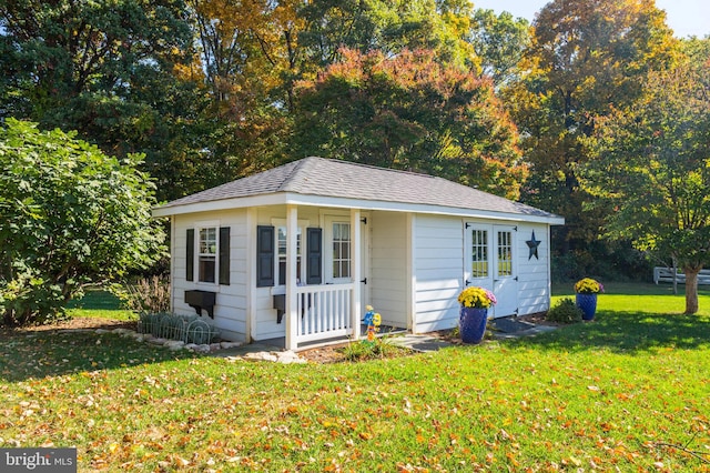 view of outbuilding featuring a lawn