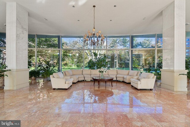 sunroom featuring an inviting chandelier