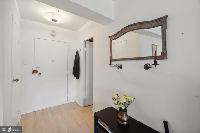 entryway with light hardwood / wood-style floors