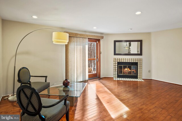 sitting room featuring hardwood / wood-style flooring and a fireplace