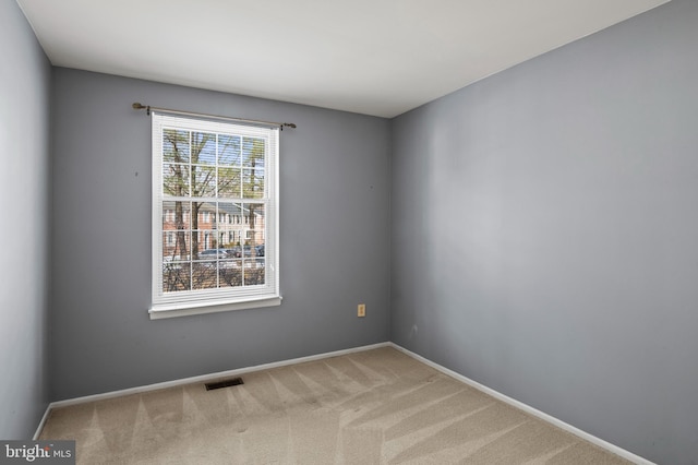 spare room featuring carpet flooring