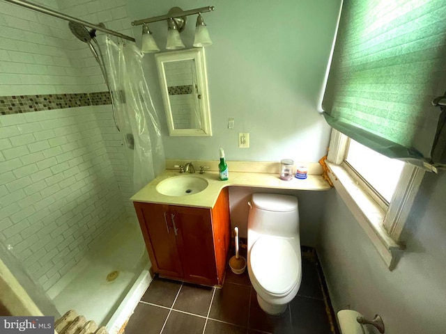 bathroom featuring vanity, curtained shower, toilet, and tile patterned flooring