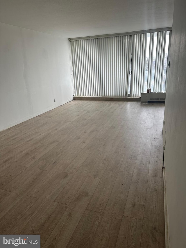 empty room featuring hardwood / wood-style floors