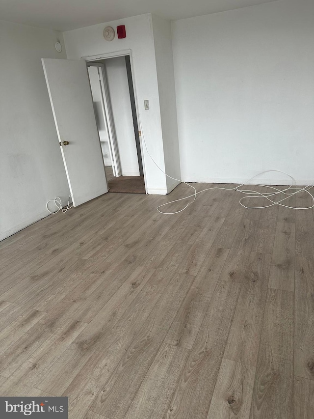 spare room with light hardwood / wood-style floors