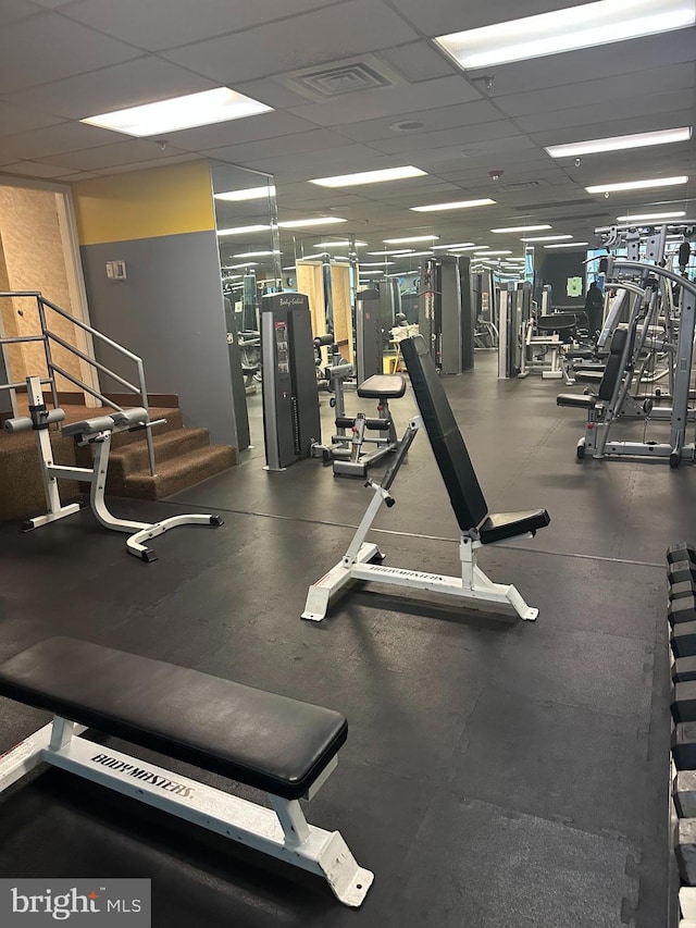 workout area with a drop ceiling