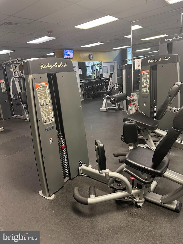 gym featuring a drop ceiling