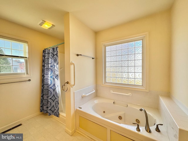 bathroom with separate shower and tub