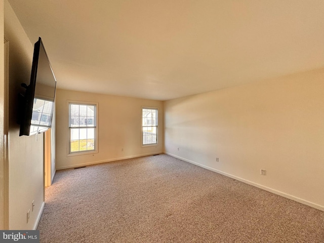 empty room with carpet flooring