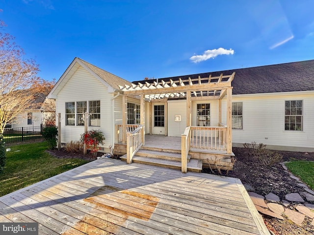 back of property featuring a pergola and a wooden deck