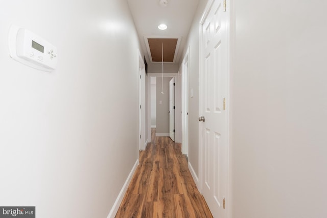 corridor featuring dark hardwood / wood-style flooring