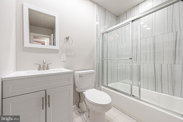 full bathroom with vanity, toilet, tile patterned floors, and enclosed tub / shower combo