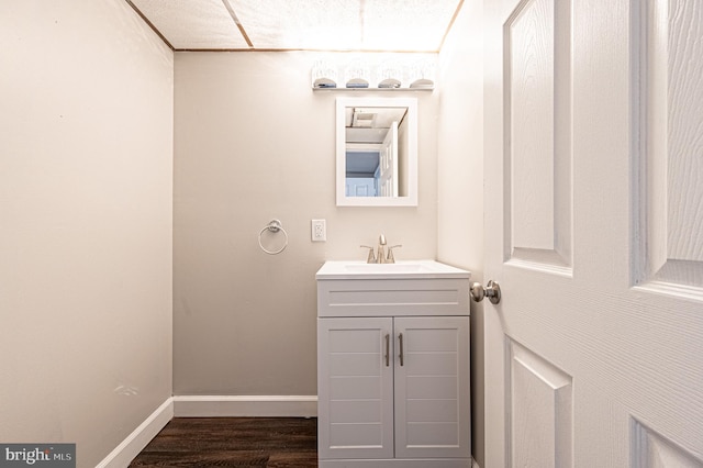 bathroom with vanity and hardwood / wood-style flooring