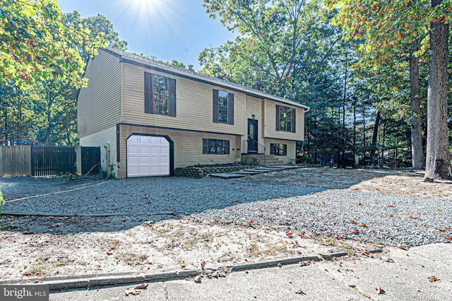 raised ranch featuring a garage