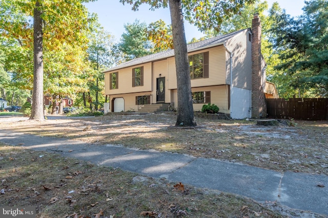 raised ranch featuring a garage