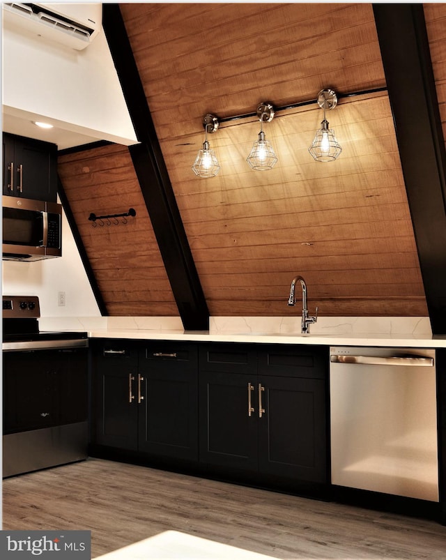 interior space with a wall unit AC, wood ceiling, wood-type flooring, and wood walls