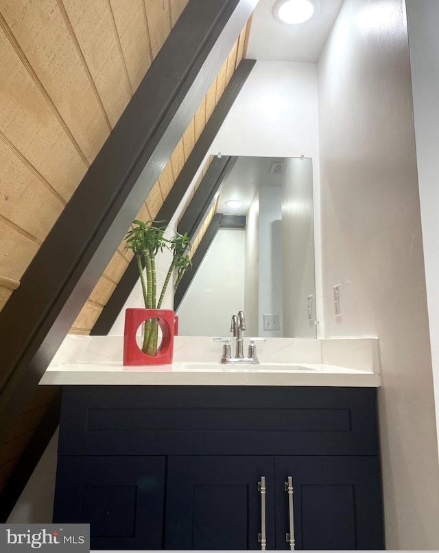 bathroom featuring vanity and wooden ceiling