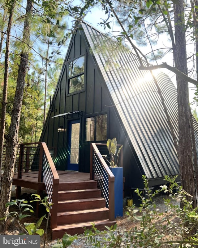 doorway to property with a deck