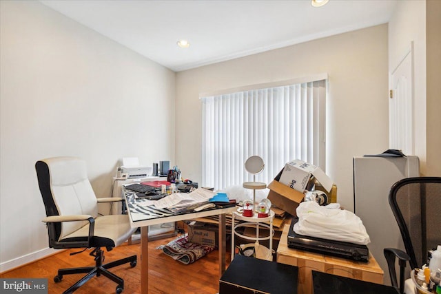 office with hardwood / wood-style flooring