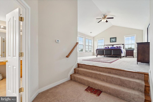 bedroom featuring ceiling fan, carpet flooring, and vaulted ceiling