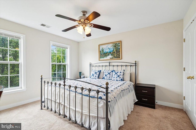 bedroom featuring ceiling fan and light colored carpet