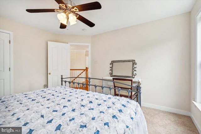 bedroom featuring ceiling fan and light colored carpet