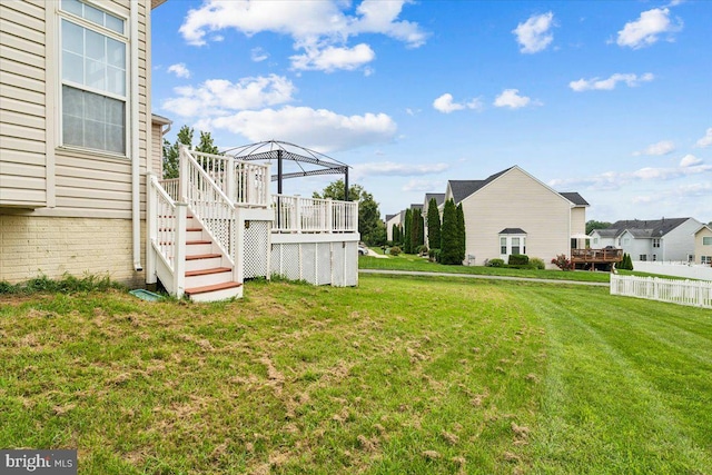 view of yard featuring a gazebo and a wooden deck