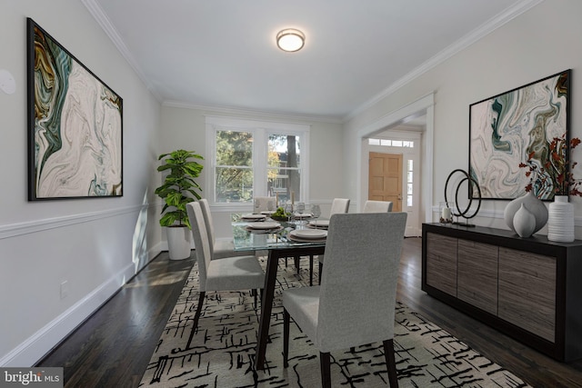 kitchen with a sink, white cabinetry, baseboards, appliances with stainless steel finishes, and light stone countertops