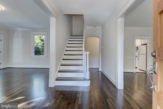 stairway featuring hardwood / wood-style flooring and ornamental molding