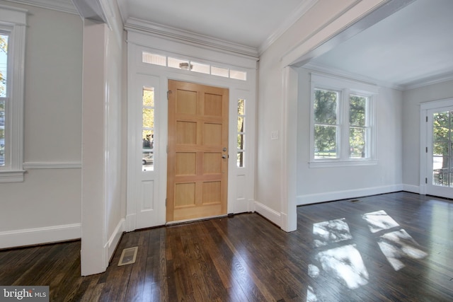 entryway with dark wood-type flooring and ornamental molding