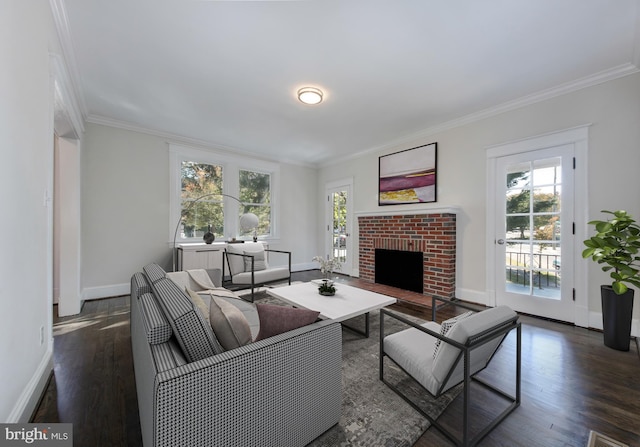 unfurnished living room featuring a wealth of natural light, ornamental molding, wood finished floors, and baseboards