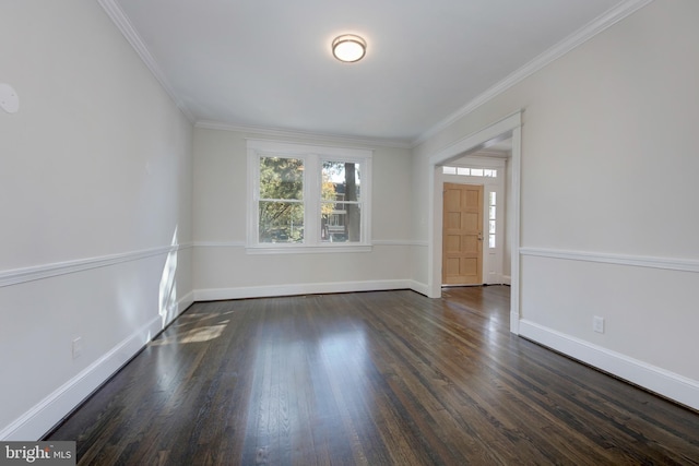 spare room with dark hardwood / wood-style flooring and crown molding