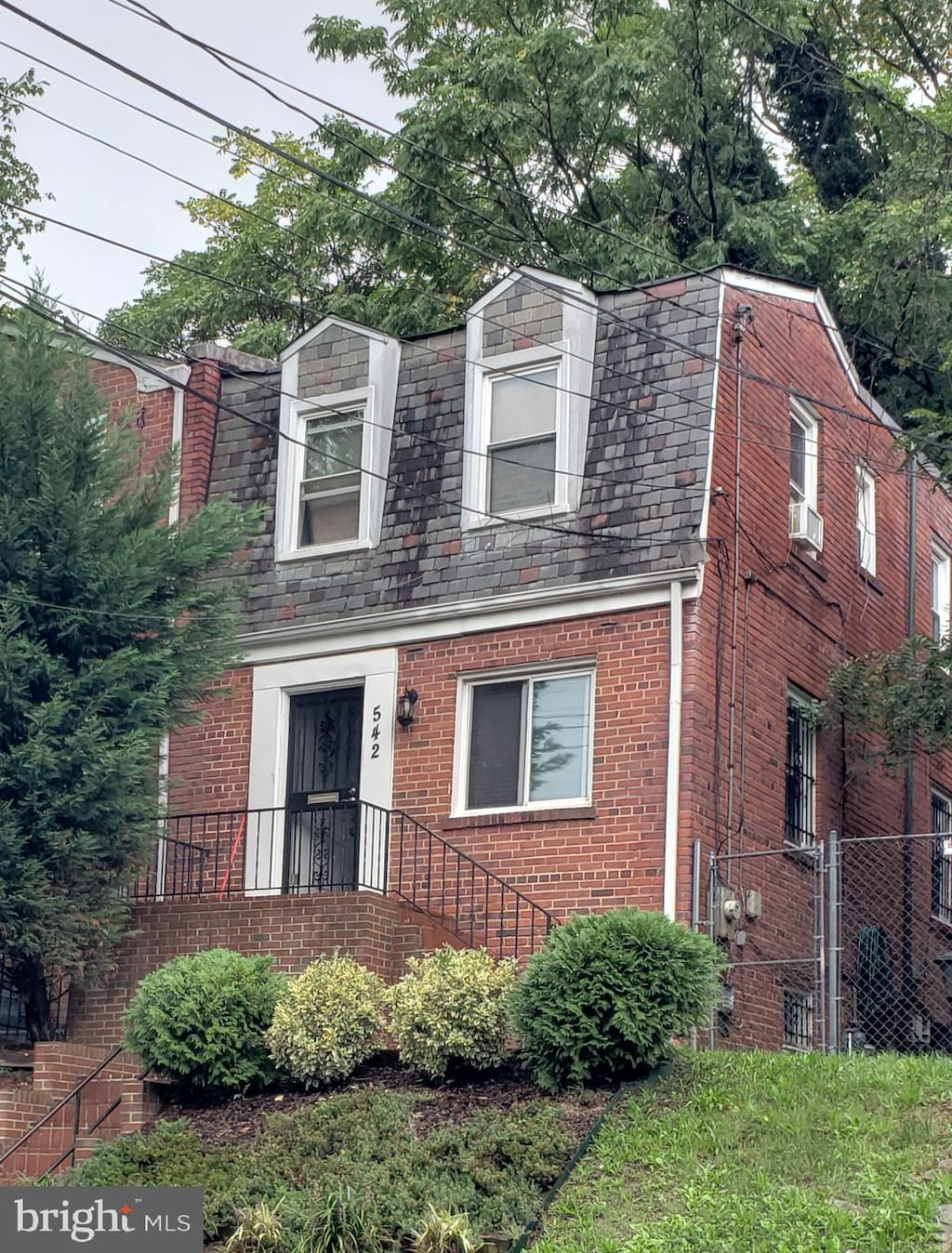 view of front of property featuring cooling unit