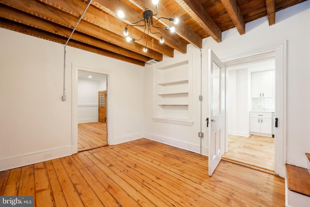 basement with wood ceiling, a chandelier, and light wood-type flooring