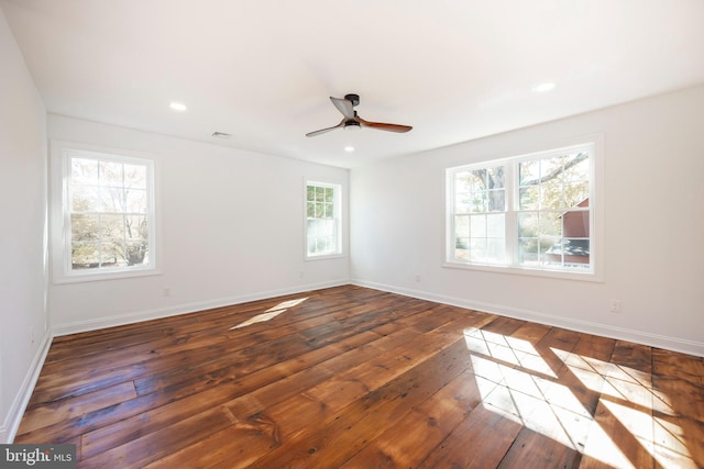 spare room featuring dark hardwood / wood-style floors and ceiling fan