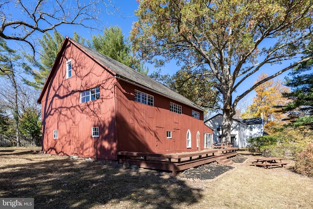 view of home's exterior with a wooden deck