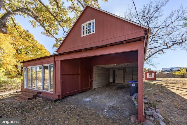 view of home's exterior with a storage shed