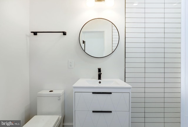 bathroom with vanity and toilet